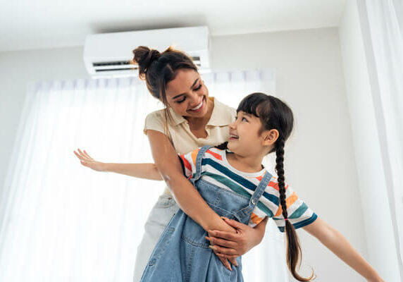 Mother and daughter enjoying ductless ac