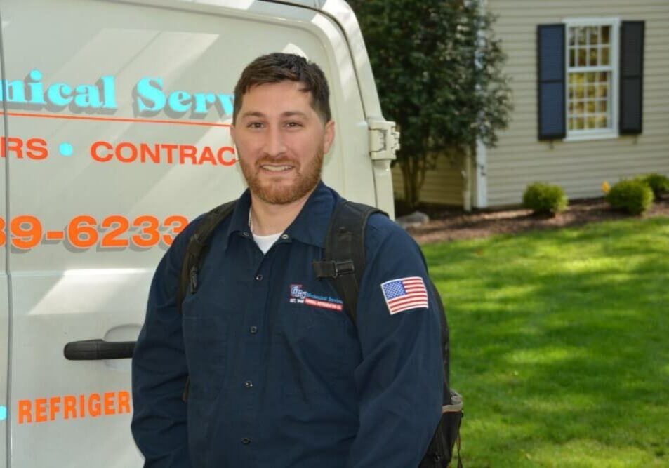 HVAC-tech-in-front-of-truck