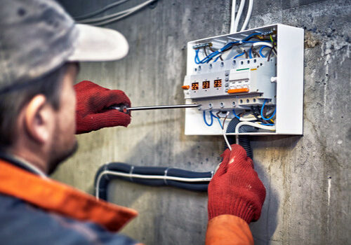 Repair technician fixing heating system