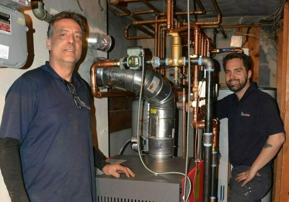 GRC technicians working on boiler installation